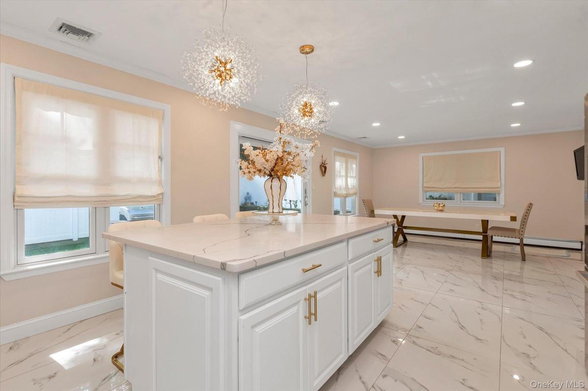 Sun-filled ground -level access to patio & fenced backyard. .