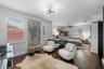 3rd Bedroom with sitting area — Bedroom with separate seating area, barn door, and modern light fixture.