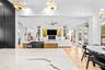 Veined stone island countertop with view to the family room and French doors beyond.
