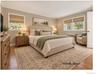 The first floor Primary Bedroom features original hardwood floors, 2 closets, and private bathroom.