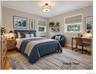 The second Bedroom on the first level also offers original hardwood floors.
