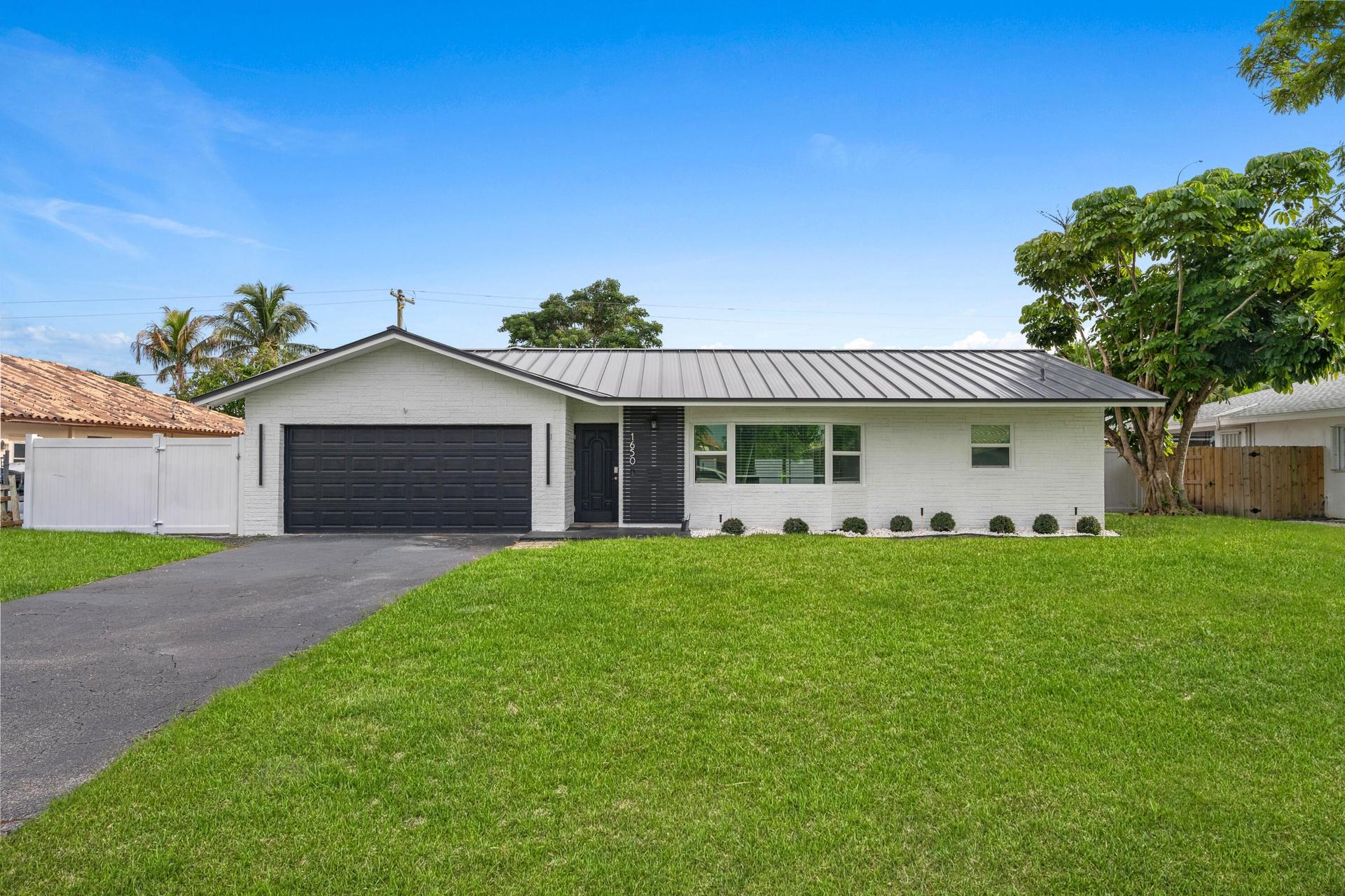 Two Car Garage with Mini Split AC and a Large Driveway!