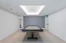 Recreation room featuring a contemporary pool table, recessed lighting, and a tray ceiling with integrated illumination