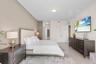 Neutral-toned walls complement the light-colored flooring