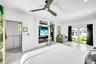 Recessed lighting, ceiling fan, built-in media console, sliding glass door, and hard surface flooring