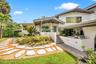 Modern exterior featuring white stucco and gray trim accents