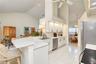 Generous counter space offers room for meal preparation and entertaining.