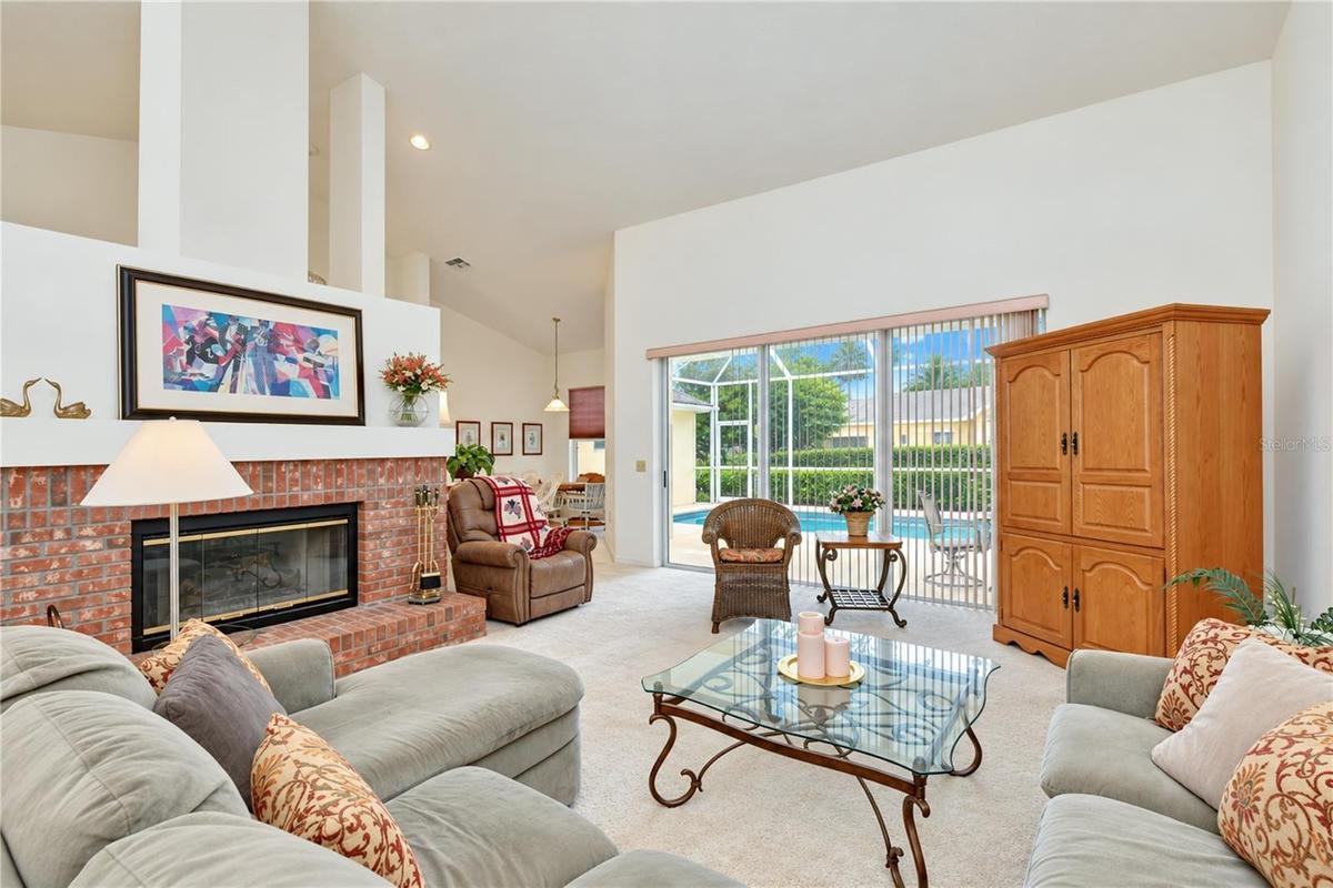 Seamless connection between the main living areas and screened pool enclosure.