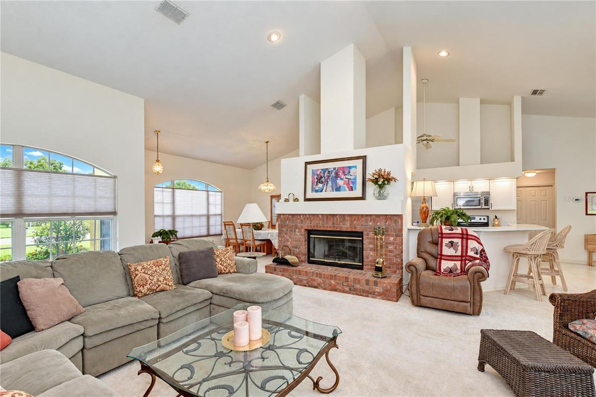 Warm and inviting fireplace creates a cozy focal point for the great room.