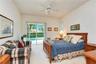 Direct access from the primary suite to the screened lanai and pool area.