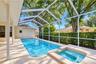 Attached spa adds a relaxing resort-style feature to the outdoor living space.