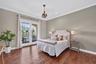 Upstairs Bedroom 7 offers ensuite bath and French Door access to Private BALCONY.