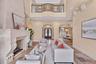 The formal dining area can be seen to the back right. This home is made for entertaining!