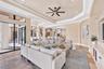 Casual family room with built-in TV wall (all televisions CONVEY with the house). Notice the speakers in the ceiling. The WHOLE house has a newly adde