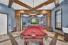 The NEW 100' Television conveys with the home ($10K value)!. The closet entry midway down left wall opens to AV equipment.