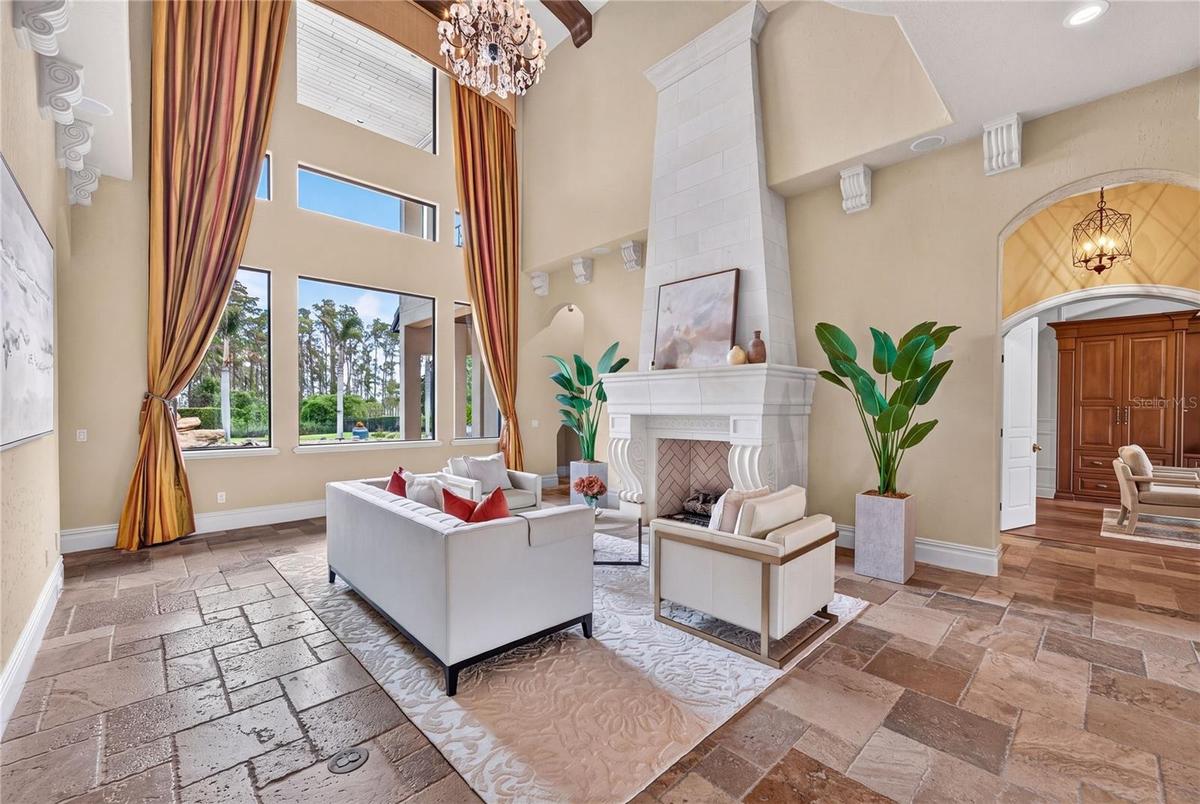 The hall to the right off the formal living leads to the guest half bath and dedicated office.