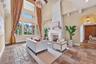 The hall to the right off the formal living leads to the guest half bath and dedicated office.