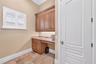 Another view of first floor laundry with storage closet.