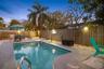 The private HEATED POOL takes center stage in this fully fenced backyard, with plenty of room to relax, dine, and enjoy Florida evenings outdoors.