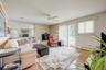 Den off the Entry Foyer with a fireplace and sliding glass doors to the rear deck.
