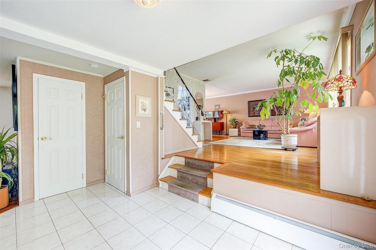 Step up into the L-shaped Living Room and Dining area