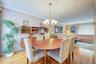 This view is from the kitchen doorway into the dining room and the Living Room behind.