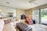 View of the large deck and expansive backyard through the door of the Den
