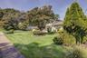 Landscaped trees and shrubs provides amazing curb appeal