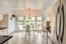 Eat-in kitchen overlooks the built in pool in the yard.