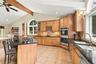 Bathed in natural light and overlooking the grounds, this kitchen commands attention.