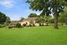 Manicured grounds unfold into private spaces for dining, lounging and recreation.