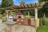 Outdoor entertaining reaches another level with a built-in grill and pizza oven.