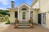 A beautifully appointed entrance creates an inviting transition into the kitchen.