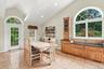 A spectacular kitchen beneath a soaring vaulted ceiling.