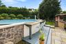 A private pool retreat surrounded by mature landscaping.