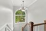 Signature arched windows bring natural light deep into the interiors.