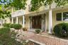 A striking stucco residence defined by graceful arches, elegant columns and unmistakable presence.