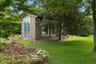 Beautifully landscaped grounds extend the living experience beyond the walls of the home.