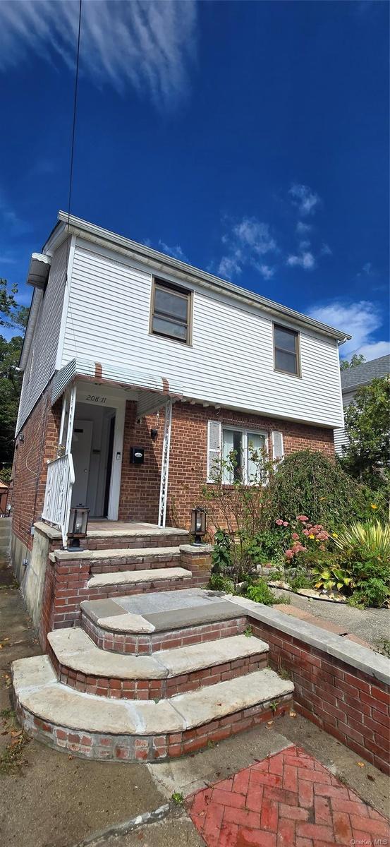 Brick and siding facade with a covered entry