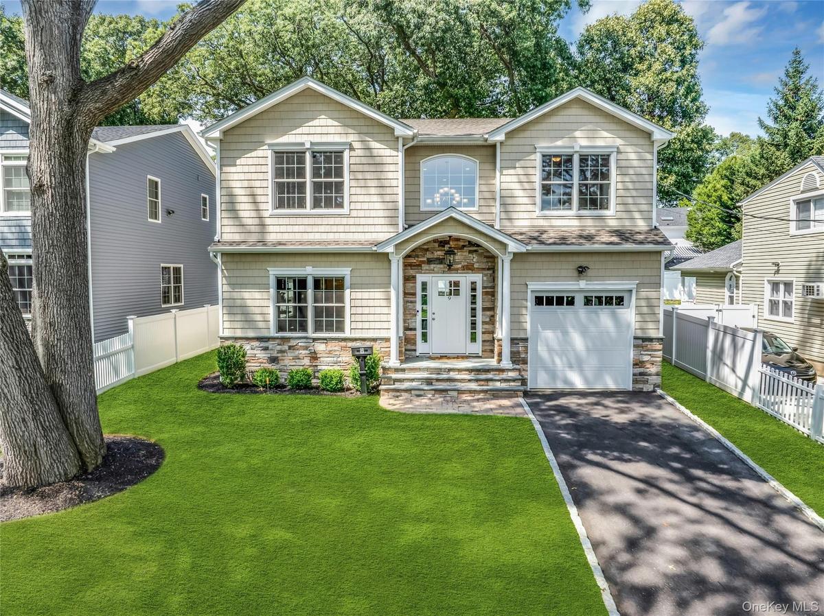 Colonial with one car garage.