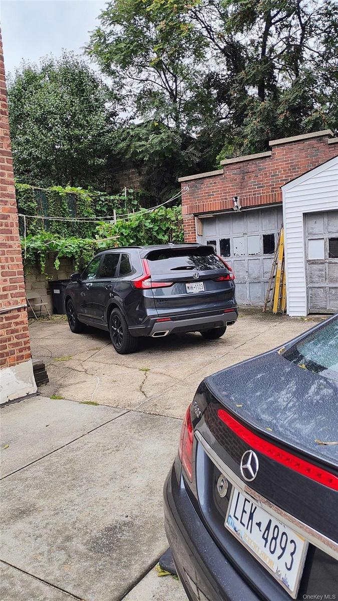 Two Car Garage And Parking Area