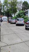 Two Car Garage And Parking Area