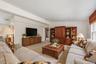 Large living room with ample wall space for entertainment and plenty of room for multiple seating areas.