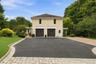 Two-car garage space provides effortless parking and additional storage.