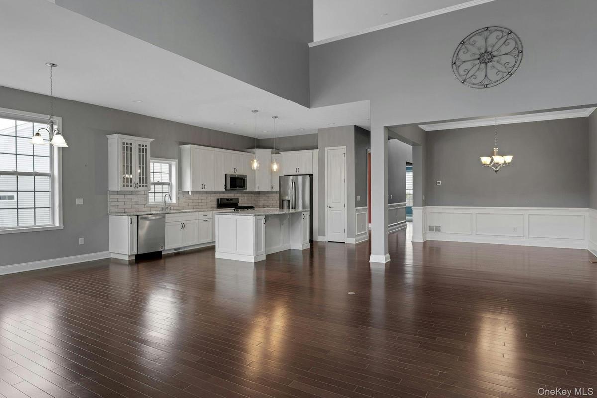 Formal Dining Room With Kitchen In Background