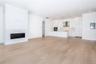 Unfurnished living room with light wood-type flooring and electric panel