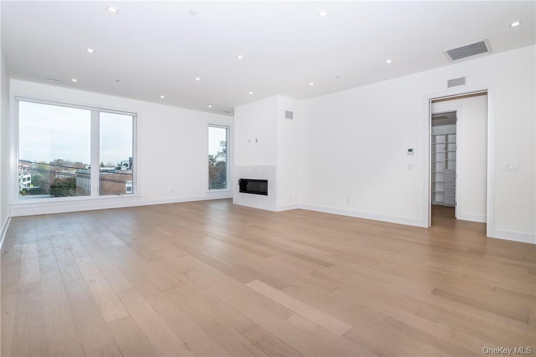 Unfurnished living room featuring light hardwood / wood-style flooring