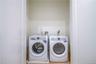 Laundry room featuring light hardwood / wood-style floors and independent washer and dryer
