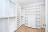 Spacious closet featuring light wood-type flooring