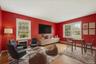 Virtually staged to show the spaciousness of the family room.